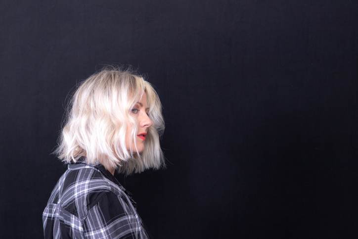 Woman With Platinum Blunt Shoulder Length Bob Hairstyle Woman With Platinum Blunt Shoulder Length Bob Hairstyle