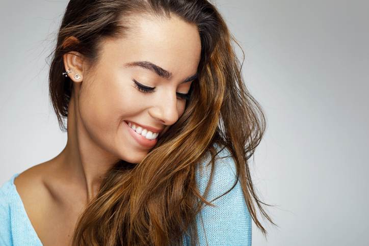 Portrait of a young woman with a beautiful smile Portrait of a young woman with a beautiful smile