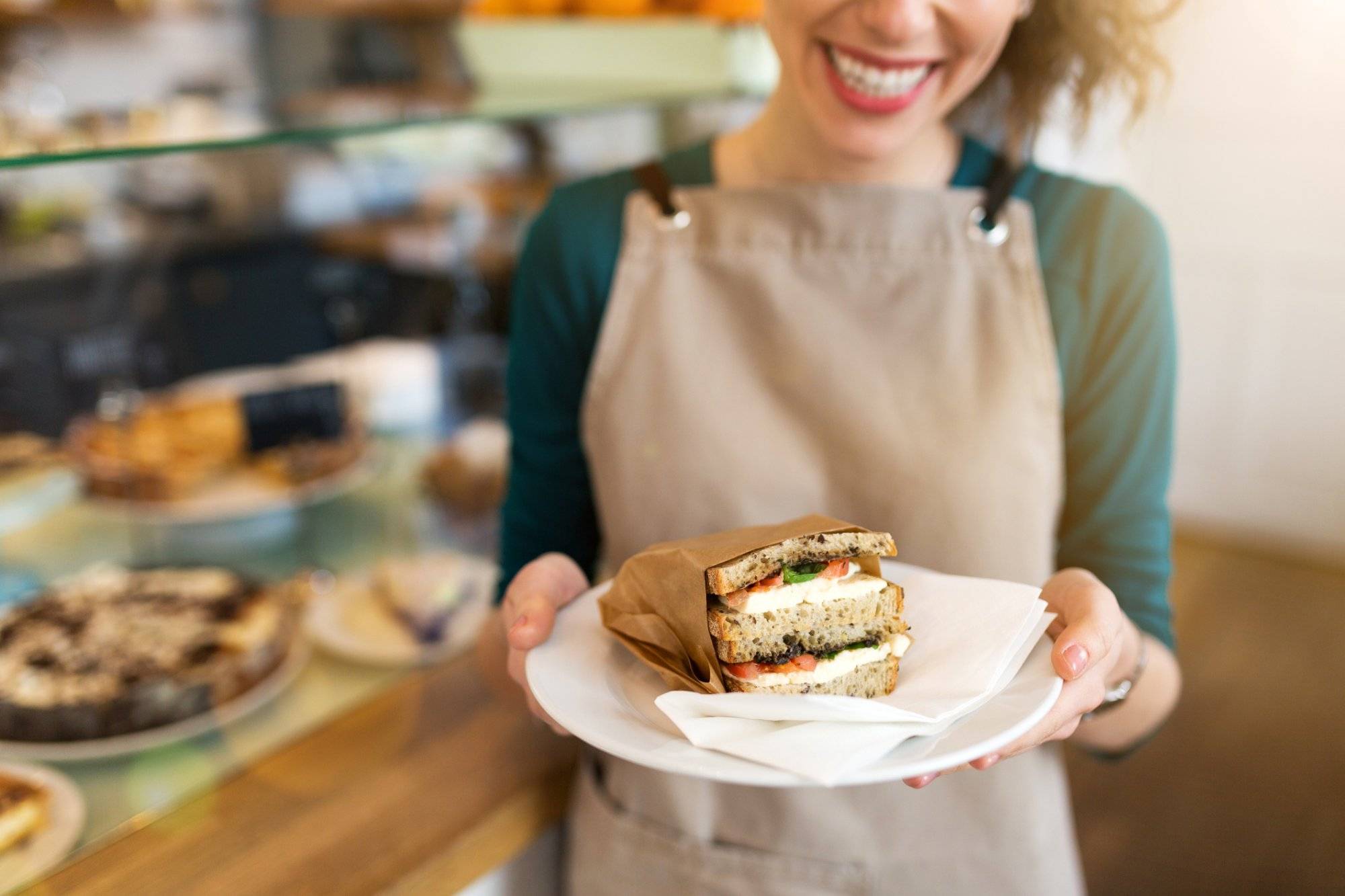 Waitress ready to serve food in cafe Waitress ready to serve food in cafe