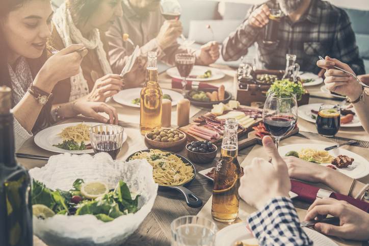 Group of people having meal togetherness dining